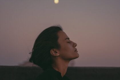 woman relaxing at dusk