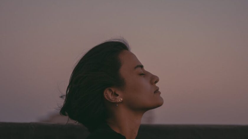 woman relaxing at dusk